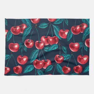 Red cherries on dark blue kitchen towel