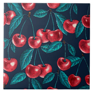 Red cherries on dark blue tile