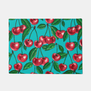 Red cherries on turquoise doormat