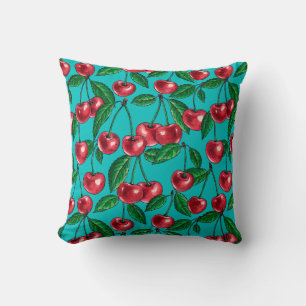 Red cherries on turquoise throw pillow