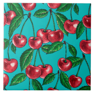 Red cherries on turquoise tile