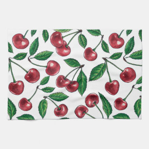 Red cherries on white kitchen towel
