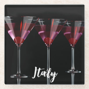 Red cocktails in martini glass with cherry glass coaster