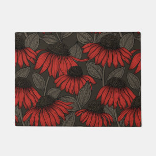 Red coneflowers on brown doormat