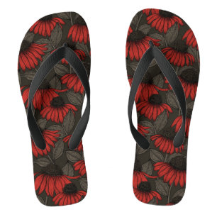 Red coneflowers on brown flip flops