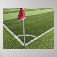 Red corner flag on soccer field