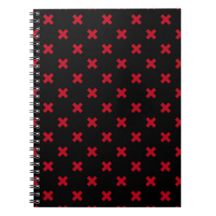 Red cross stitches on black notebook