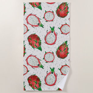 Red dragon fruit on off white beach towel