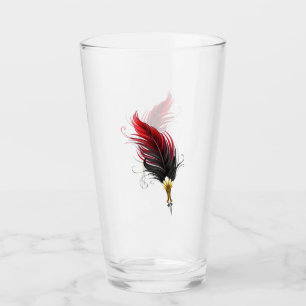 Red feather pen with gold nib glass