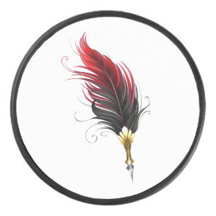 Red feather pen with gold nib hockey puck