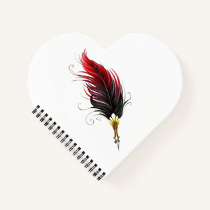 Red feather pen with gold nib notebook