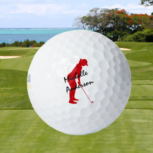 Red Female Golfer Putting Golf Balls