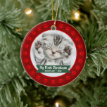 Red First Christmas Pet Kitten Photo Paws Custom Ceramic Ornament<br><div class="desc">“My First Christmas.” Celebrate your new pet’s arrival this past year! A red banner with your pet’s name and year in whimsical white typography overlays your kitten or puppy’s custom photo. A playful border of red paw prints against brick red surrounds it. Feel the warmth and joy of the holiday...</div>