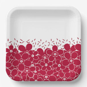 Red flowers daisies on white background paper plate