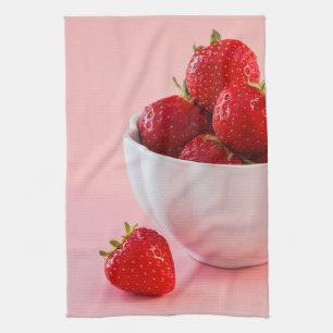 Red Fresh Strawberries In A White Bowl On Pink Kitchen Towel