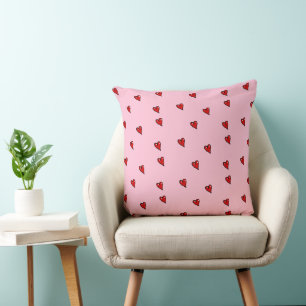 Red glossy hearts on pink throw pillow