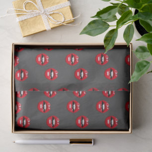 Red glossy lips on grey tissue paper