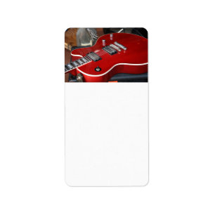 Red guitar on amp label