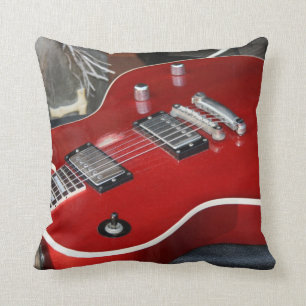 Red guitar on amp throw pillow