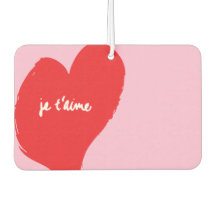 Red heart with je t’aime-text on pink background