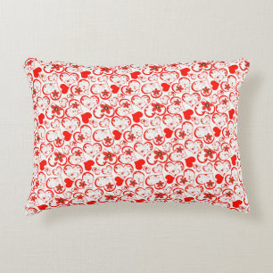 Red hearts and flowers on a white accent pillow