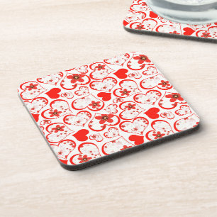 Red hearts and flowers on a white coaster