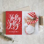 Red Holly Jolly Hand Lettering Baby Photo Holiday Card<br><div class="desc">Festive Holly Jolly Hand Lettered Photo Holiday Card | Send festive holiday greetings to family and friends with this customizable holiday flat card. It features a hand-lettered "holly jolly" overlay with snow and snowflakes accent. Customize by adding your favourite photo. Matching items are available.</div>