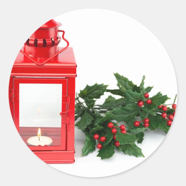 Red lantern with tealight holly twigs and berries classic round sticker (Front)