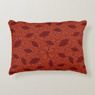Red leaves pattern on orange accent pillow