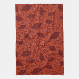 Red leaves pattern on orange kitchen towel