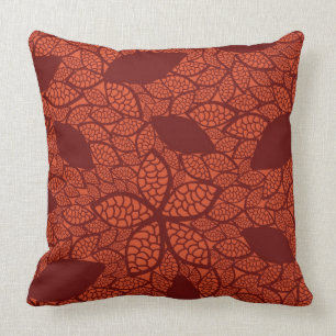 Red leaves pattern on orange throw pillow