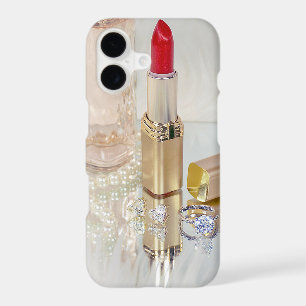 red lipstick and jewellery on mirror