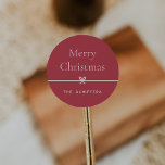 Red | Modern Bow Simple Minimal Christmas Classic Round Sticker<br><div class="desc">Finish your holiday mailings and gifts with these sweet and simple Christmas stickers,  customizable with your preferred holiday greeting and family signature (shown with "Merry Christmas") on a red background. A petite bow running through the centre completes this elegant minimalist holiday design.</div>