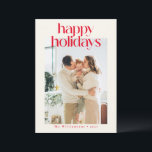 Red Modern Custom Photo Happy Christmas Minimalist Holiday Card<br><div class="desc">Spread holiday cheer with this stylish Happy Holidays card, featuring bold red text on a warm cream background. This minimalist design is both elegant and timeless, perfect for sending seasonal greetings with a modern twist. Personalize with your family name to add a personal touch, making it easy to share festive...</div>