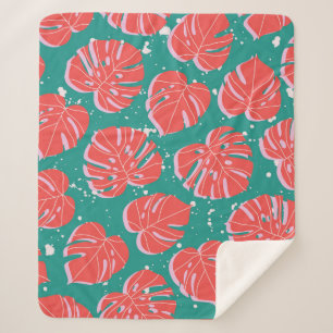 Red monstera leaves on green seamless pattern. Tre Sherpa Blanket