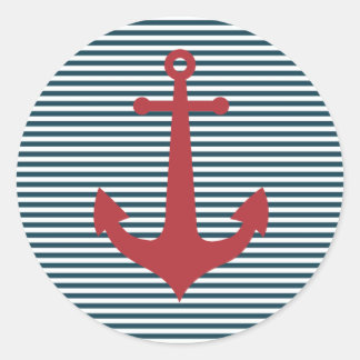 Red nautical anchor on striped blue background classic round sticker
