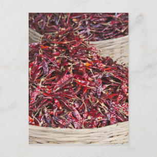 Red peppers at local produce market postcard