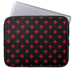 Red polka crosses on black laptop sleeve