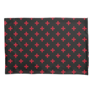 Red polka crosses on black pillowcase