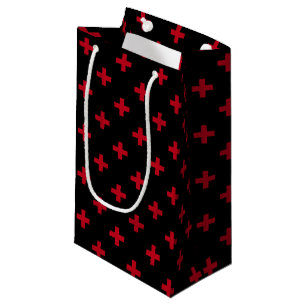 Red polka crosses on black small gift bag