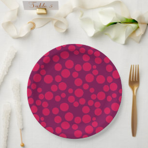 red polka dots on a white background paper plate