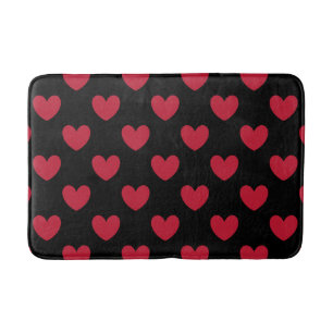Red polka hearts on black bath mat