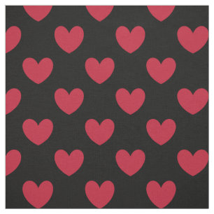 Red polka hearts on black fabric