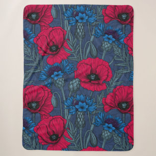 Red poppies and blue cornflowers on blue sherpa blanket