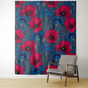 Red poppies and blue cornflowers on blue tapestry