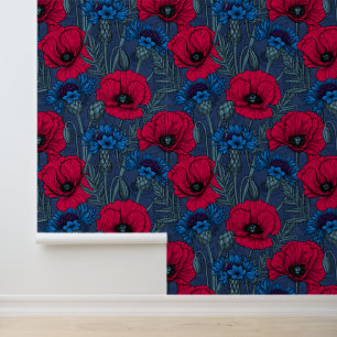 Red poppies and blue cornflowers on blue wallpaper