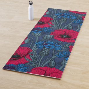 Red poppies and blue cornflowers on blue yoga mat