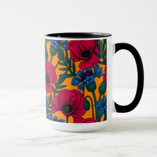 Red poppies and blue cornflowers on orange mug