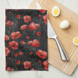Red poppies on black kitchen towel