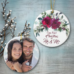 Red Roses First Christmas Photo Template Ceramic Ornament<br><div class="desc">Here's a beautiful ornament that makes a wonderful keepsake for a newlywed couple. The front has a pretty red roses and holly floral bouquet at the top, with red script that says "Our First Christmas as Mr. & Mrs." at the bottom. The image and text are placed on a white...</div>